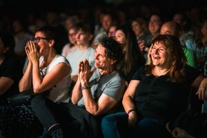 The laughing audience at the international stand-up comedy festival <!--LINK'" 0:310-->, Ljubljana 2022. Author: Jaka Škrlep