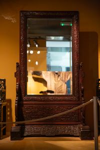 A Chinese wooden mirror in the Skušek Collection, <!--LINK'" 0:80-->.