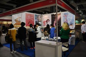 <!--LINK'" 0:935--> presenting their catalogue at the Shanghai Book Fair, 2014