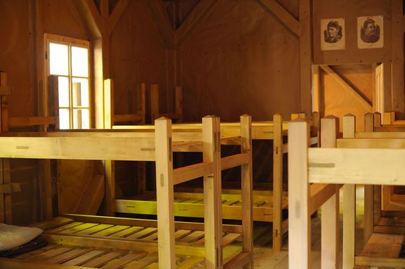 A room with bunk beds for the wounded in one of the 14 barracs of the Franja Partisan Hospital. A reconstructed site, 2010.