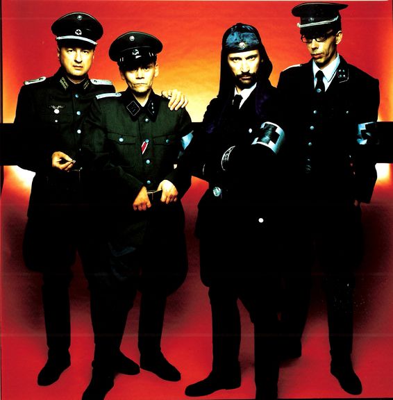 Following the release of the album WAT (Mute Records,2003), Laibach carried out a major European tour in 2003. Sung in both German and English WAT pondered the major topics of the Iraq War, anti-Semitism, terrorism and crisis in the modern world.