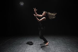 <!--LINK'" 0:72--> on the small stage of the <!--LINK'" 0:73--> during her piece <i>Zaklenjeno</i> [Locked], performed at the <!--LINK'" 0:74-->, 2017