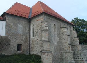 The south-east view of the synagogue after its restoration in 2001. The building forms a part of the Maribor medieval town walls above the Drava River; <!--LINK'" 0:62-->.