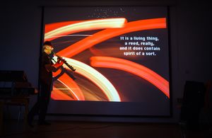 <!--LINK'" 0:540--> during his multimedia act, merging photography, poetry and solo saxophone at <!--LINK'" 0:541-->, 2014