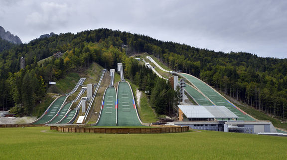 A late summer view of a few of the ski jumping hills in the Nordic Center Planica, the sports objects designed by A.biro, the landscape architecture AKKA Studio, 2014.