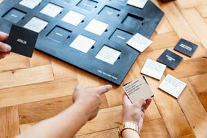 Original gallery game activitiy, a board game <i>Let’s Switch on the Lights in the House</i>.