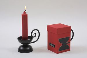 The <!--LINK'" 0:84--> offers various souvenirs related to decorative metalwork. This particular candlestick is based on a design by the renowned architect [[::Category:Plečnik_heritage|Jože Plečnik]].