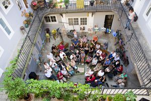 A poetry reading and painting exhibition, held in one of the courtyards in Maribor and organised by the <!--LINK'" 0:64-->, 2017
