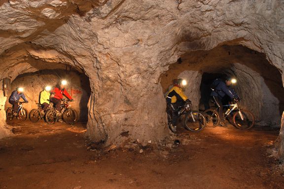 The guided cycling tour along the Podzemlje Pece, Tourist Mine and Museum in Mežica.
