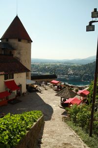 View looking down into the lower courtyard, showing castle outbuildings at <!--LINK'" 0:70-->, the tower now holds the Castle printing works 2010