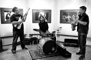 Ljubljana based Jazz band <!--LINK'" 0:145--> performing at <!--LINK'" 0:146-->, at the opening of the photographic exhibition of concert photographs <i>Lak na nohtih</i> [Painted nails] by band member <!--LINK'" 0:147-->