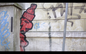 A still frame from the <!--LINK'" 0:292--> promo video featuring grafitti in Ljubljana, 2013
