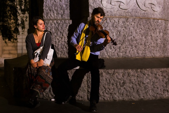 Street musicians playing under the statue of a romantic poet France Prešeren on Prešeren Square, the central square in Ljubljana, 2014