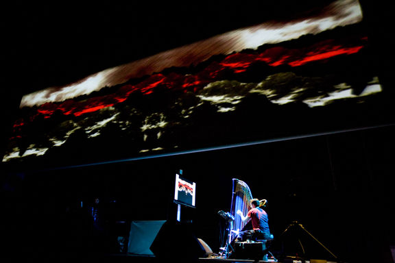 Audio visual concert Deceiving Light, harpist Eduardo Raon, visuals by Akaša Bojič, Neja Engelsberger and Luka Umek during the closing event of Animateka, 2009