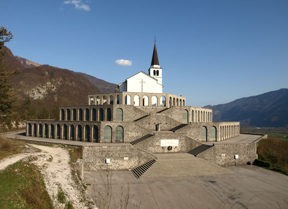 Completed in September 1938, inaugurated by Benito Mussolini, the Italian ossuary contains the mortal remains of 7014 identified and unknown Italian soldiers who fell on the Soča Front. Part of the Kobarid Museum's outdoor museum tour.