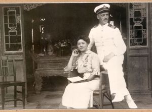 Ivan Skušek and his wife to be Tsuneko Kondō Kawase in Beijing, between 1918–1920. (The photo is kept in the library of the <!--LINK'" 0:11-->, the original is kept by Skušek's great-nephew Janez Lombergar.)